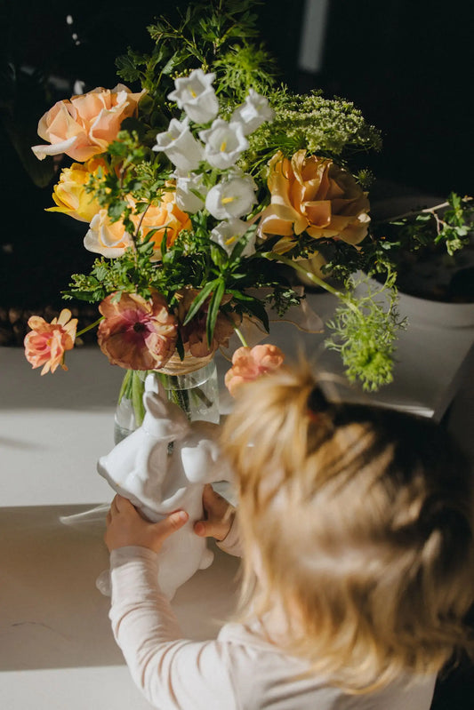 Personalized small flower bouquet being arranged in vase hand-crafted by Kvetka Flower
