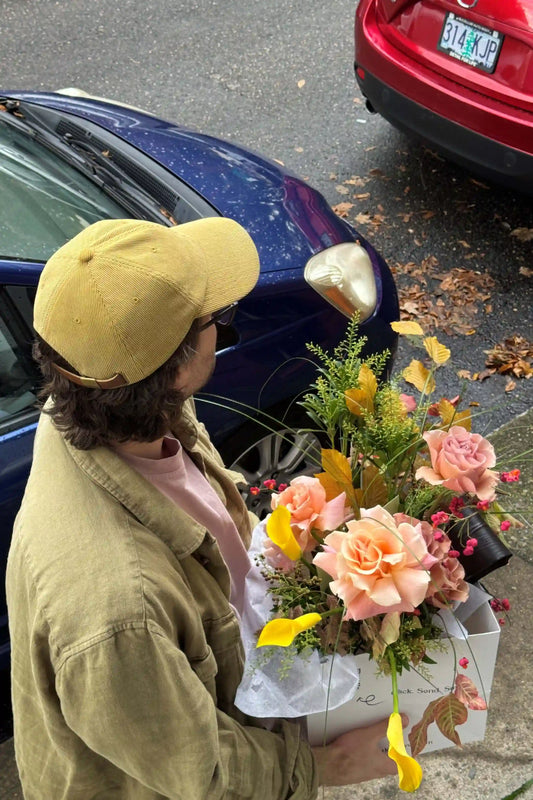 Medium seasonal rose bouquet with yellow calla lilies autumn leaves hand-crafted by Kvetka Flower